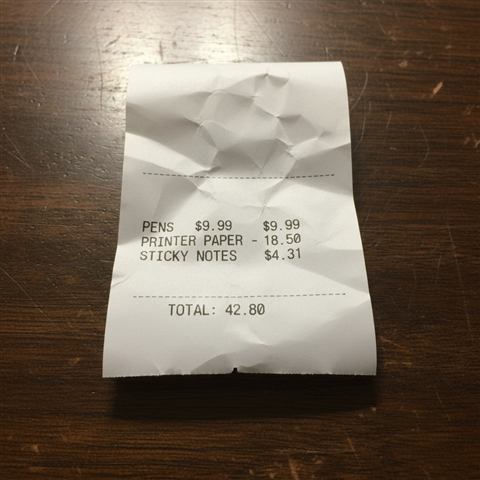 Photo of a crumpled office-supply receipt totaling $42.80